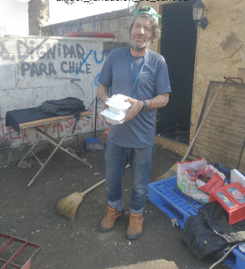 Food handout for people living on the street in Santiago.