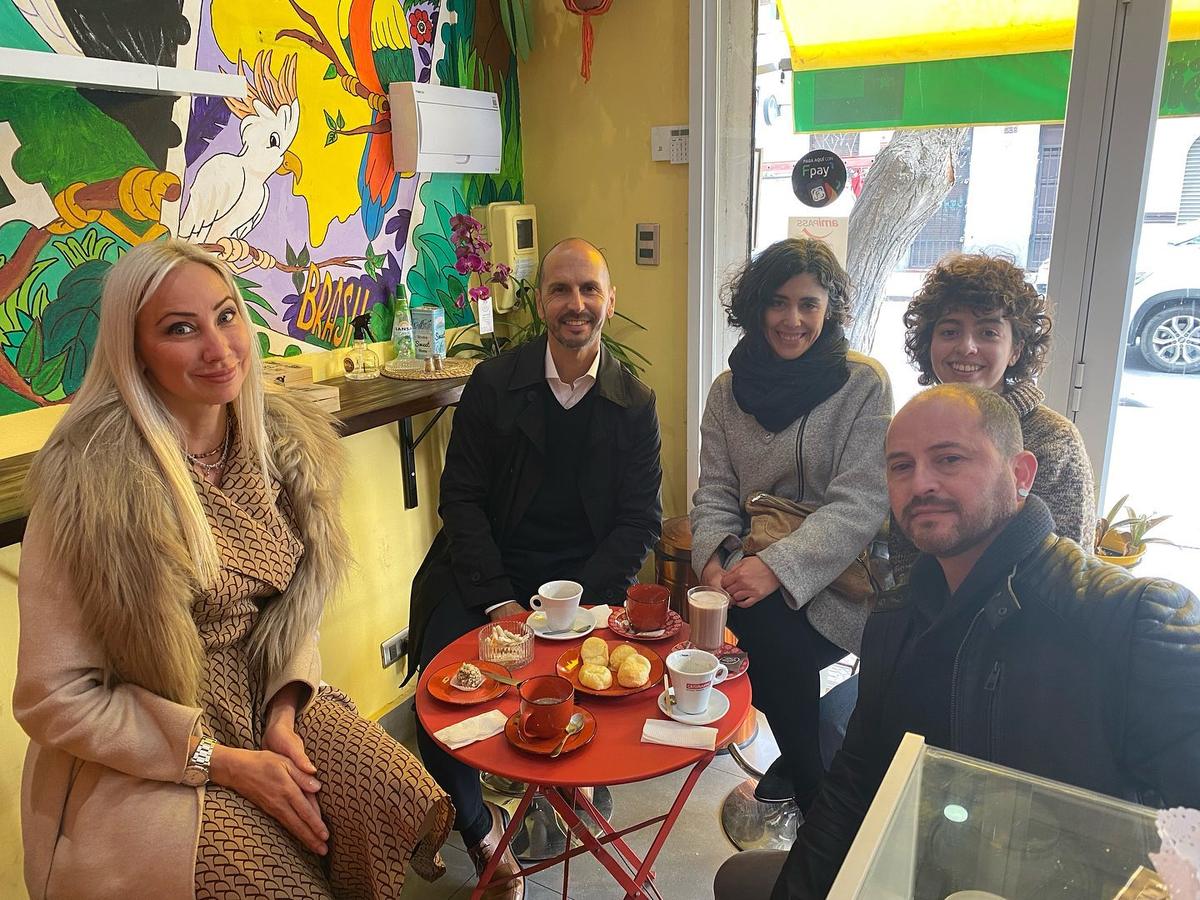 Five members of the foundation team at a café